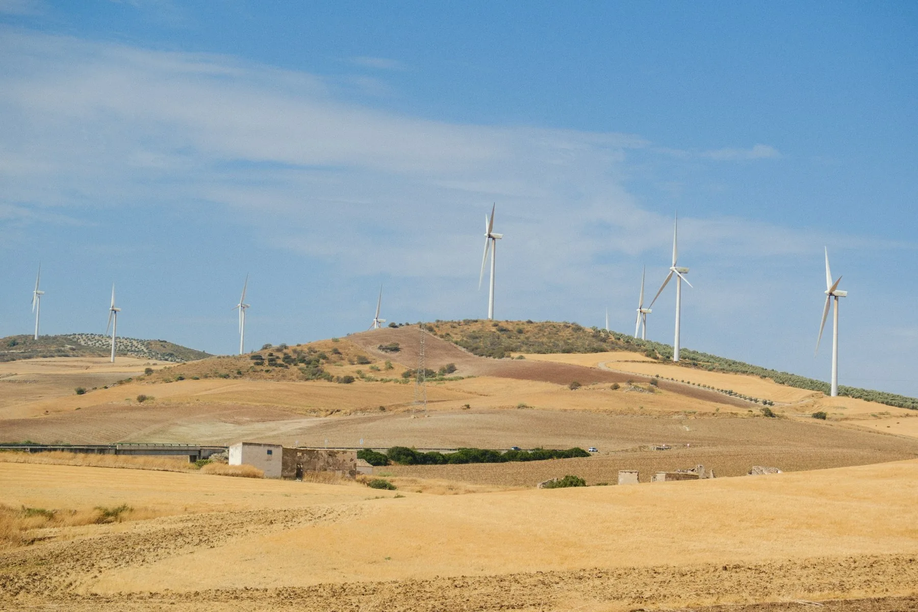 Wind turbines on hills; illustrative new energy photograph